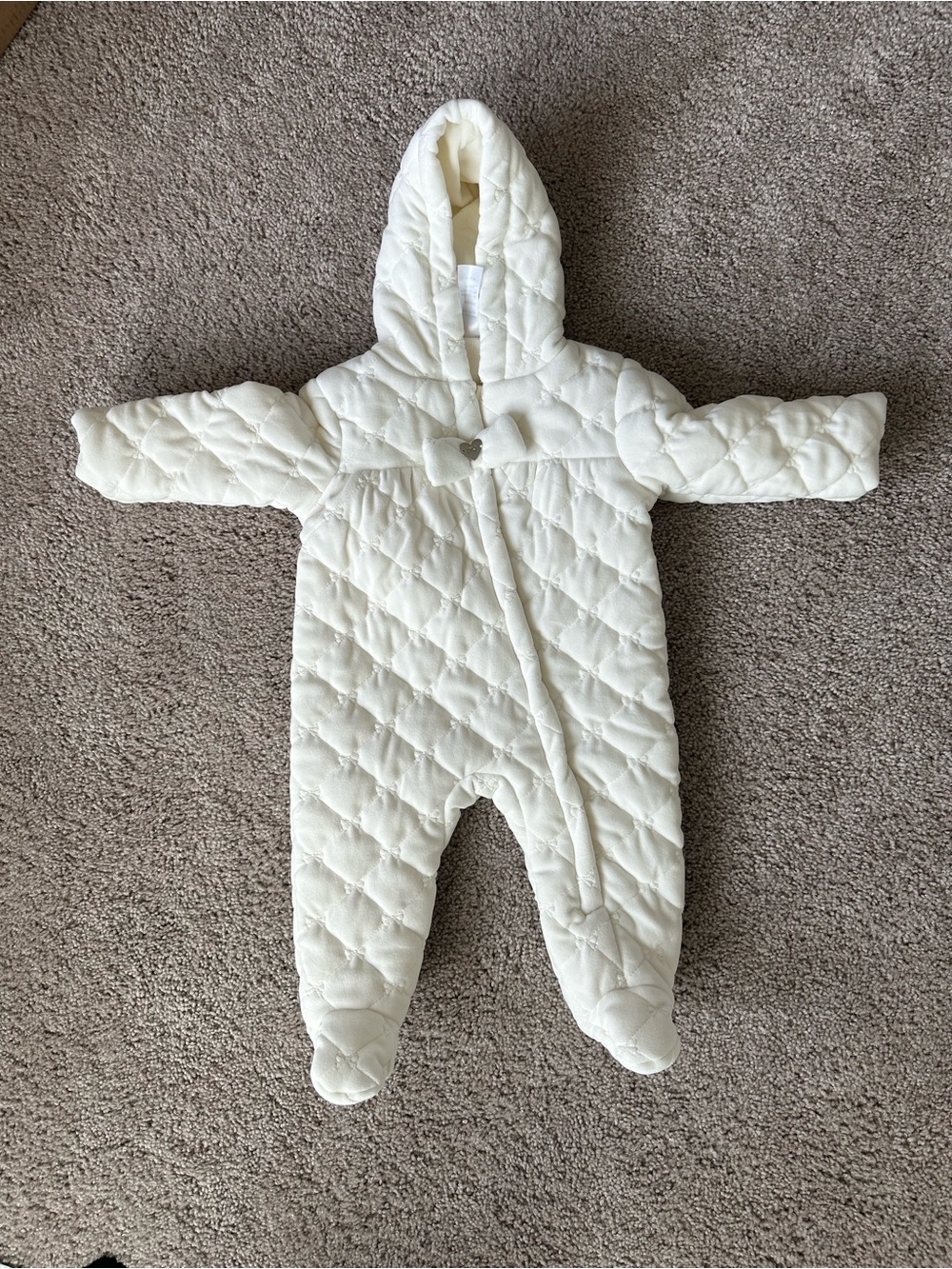 Cream quilted diamond pattern baby snowsuit in a size 6/9